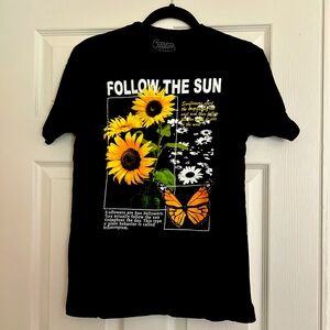 Black and yellow “Follow The Sun” graphic tee